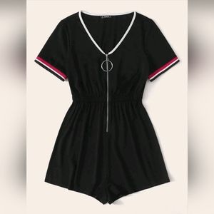 Black jumper with zipper front.